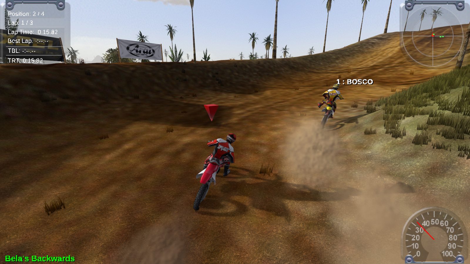 Two riders racing on a sandy national track