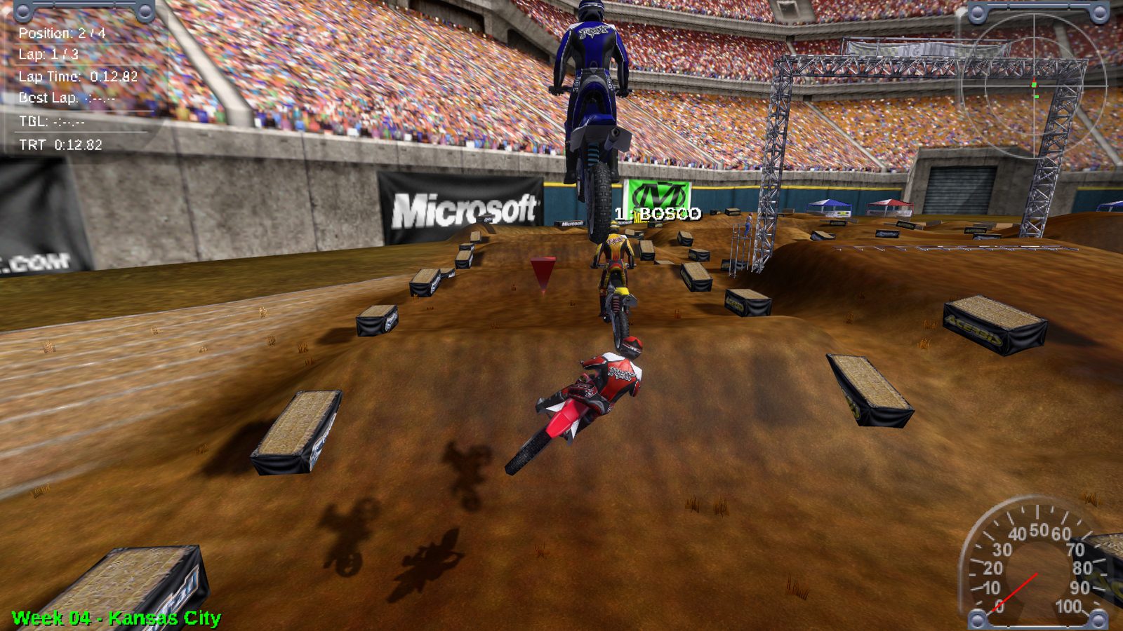 A rider in the air over a supercross triple